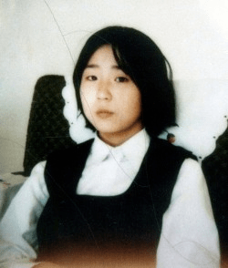 colour photograph of Megumi Yokota in formal dress looking at camera